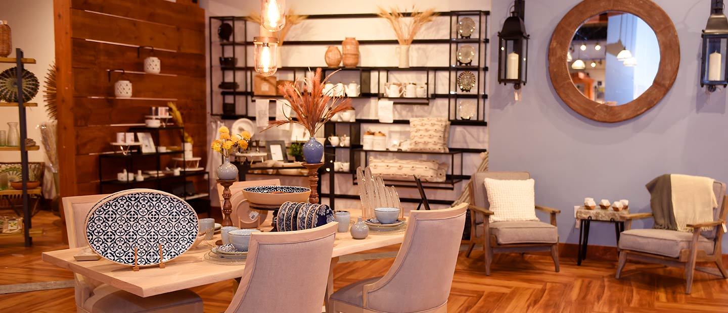 Table and Chair set with platters and wall decor in background